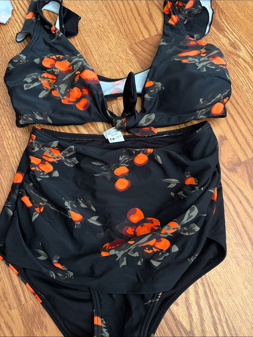 COCOSHIP Black Swim Top with Subtle Orange Detail